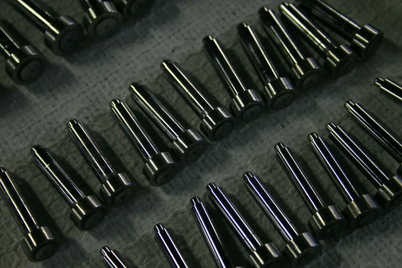 Rows of precision metal components on a work surface